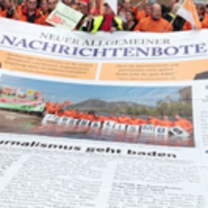 Im Rahmen einer Streikaktion wird eine große Bodenzeitung ausgelegt